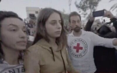 Israeli hostage Mia Schem is transferred to Red Cross custody by Hamas terrorists, in Gaza City, ahead of her return to Israel, November 30, 2023. (The Times of Israel: Telegram screen capture: Used in accordance with Clause 27a of the Copyright Law)