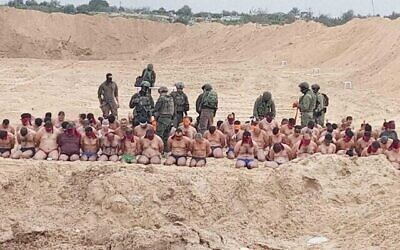 Palestinian men said to have surrendered to the IDF in the Jabaliya area of northern Gaza on December 7, 2023. (The Times of Israel: Social media: used in accordance with clause 27a of the copyright law)