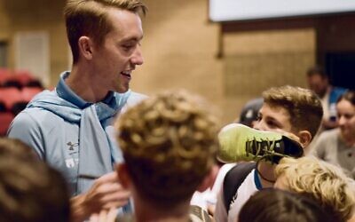 Sydney FC defender Joel King, signing autographs for juniors players at the 2024 Hakoah FC season launch at Moriah College auditorium on February 4.