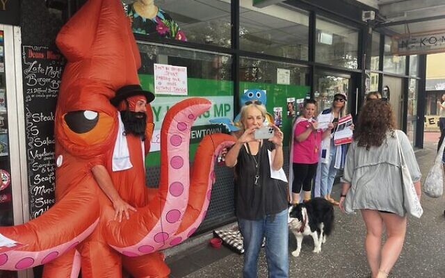 Jack Pinczewski (left) in an octopus costume outside NSW Greens MP Jenny Leong's office in Newtown last Sunday.