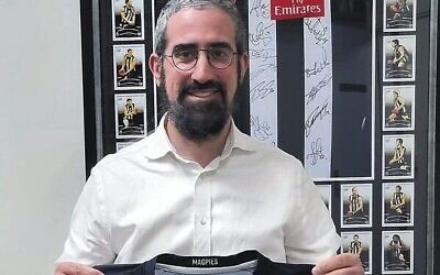 St Kilda Shule's Rabbi Glasman with the Collingwood footy jumper donated anonymously.