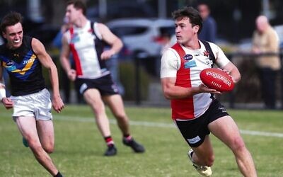 Jackas player Matt Lincoln finds space against Old Carey last Saturday at Princes Park. Photo: Peter Haskin