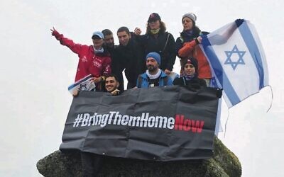 Danielle Wolfson and others call for the release of the hostages at the summit of Mount Kosciuszko.