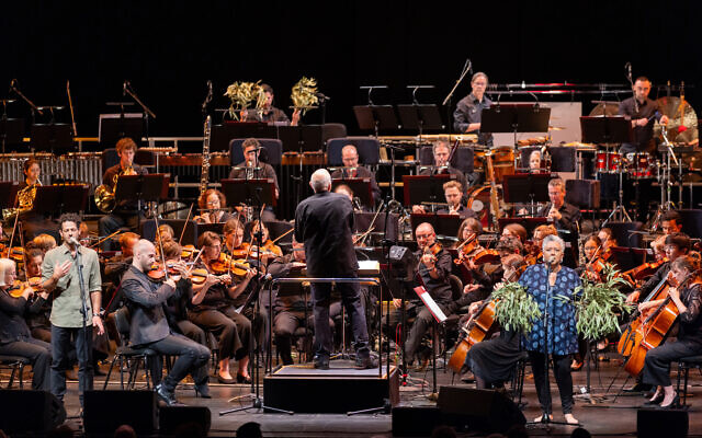 Lior (left) and Lou Bennett sing as Nigel Westlake conducts the Adelaide Symphony Orchestra in Ngapa William Cooper at the 2024 Adelaide Festival.