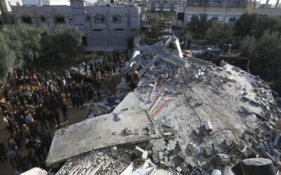 Palestinians survey the rubble of a building destroyed in an Israeli air strike in Rafah on March 3. Photo: Said Khatib / AFP