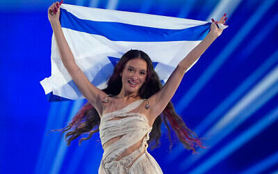 Eden Golan of Israel enters the arena during the flag parade before the Grand Final of the Eurovision Song Contest in Malmo, Sweden, May 11, 2024. (The Times of Israel: AP Photo/Martin Meissner)