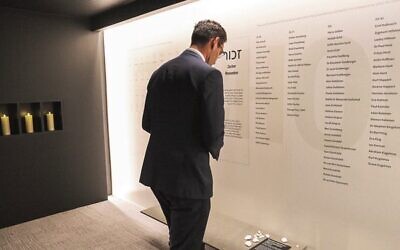 Josh Burns paying his respects at the Queensland Holocaust Museum.