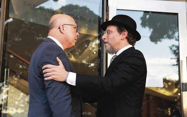 Peter Dutton (left) being welcomed to Sydney's Central Synagogue by Rabbi Levi Wolff. Photo: Nadine Saacks