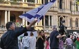 Mark Leach waves an Israeli flag at a pro-Palestinian demonstration in Sydney. Photo: Facebook
