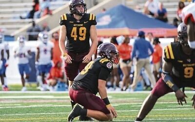 Cade Hechter preparing to kick an extra point conversion for the BCU Wildcats. Photo: BCU