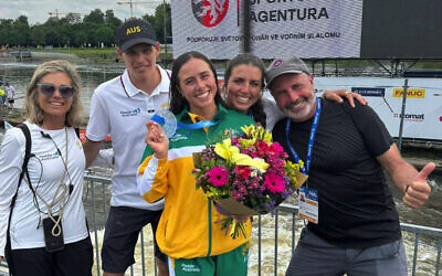 Proud as punch: Noemie Fox (front) with (from left) her mum Myriam, Australian kayak cross coach Titouan Dupras, her sister Jessica and dad Richard. 
Photo: Instagram