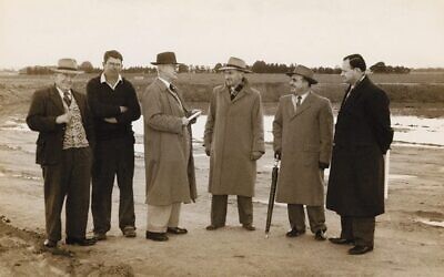 Surveying land at Cranbourne in 1952 are (from left) course designer Sam Berriman, superintendent Gordon Black, journalist Jack Dillon, Cranbourne Golf Club president Syd Kaufman, captain Harry Cohen and vice-president 
Harold Lasky.