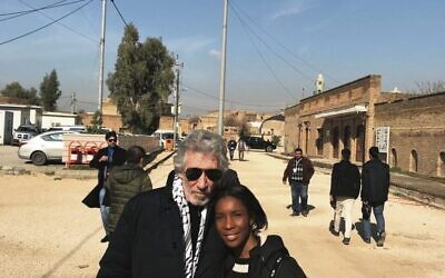 Roger Waters wearing a keffiyeh, with his wife Kamilah Chavis. Photo: Supplied