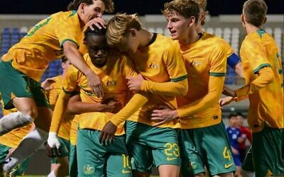 Moriah College student Jay Maltz (jumping on left) celebrates with his Joeys teammates during their 3-1 win over Kuwait.
Photo: Football Australia