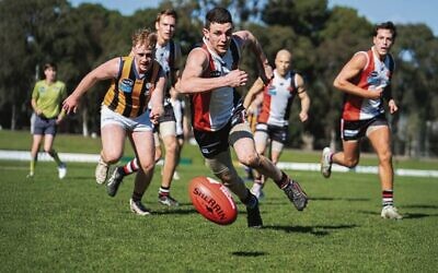 Vice-captain Eitan Potash leads a chase for the ball for AJAX in their VAFA men's premier thirds preliminary final win. 
Photo: Yaakov Frenkel 
Photography