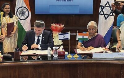 Israeli Finance Minister Bezalel Smotrich (left) and Indian counterpart Nirmala Sitharaman sign a trade deal in New Delhi last week. Photo: Israel Finance Ministry