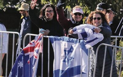 Spectators with Australian and Israeli flags.