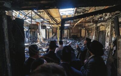 Prime Minister Anthony Albanese and members of the Jewish community visit the torched Adass Israel synagogue. Photo: Dept of PM and Cabinet/AFP