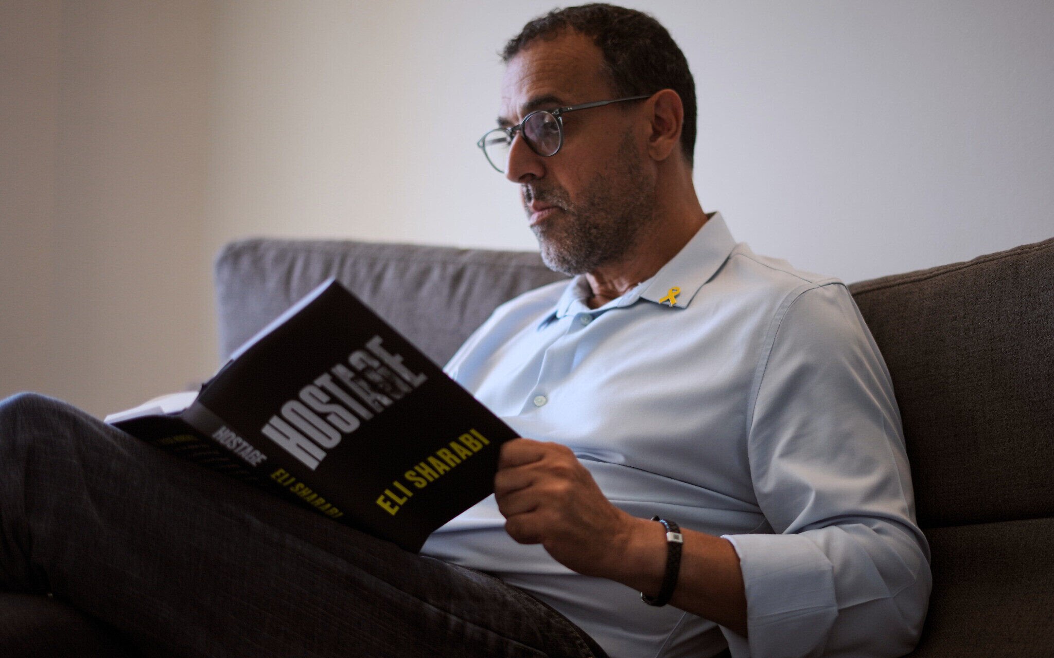 Eli Sharabi poses with his new book "Hostage" for a photo in Herzliya, on September 18, 2025. Photo: AP Photo/Ariel Schalit Eli Sharabi poses with his new book "Hostage" for a photo in Herzliya, on September 18, 2025. Photo: AP Photo/Ariel Schalit
