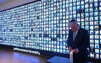 Prime Minister Benjamin Netanyahu lights a candle in memory of the victims of the war against Hamas in Gaza, next to a wall with faces of victims, at the National Library of Israel in Jerusalem, October 12, 2025. (Amos Ben Gershom/GPO) Prime Minister Benjamin Netanyahu lights a candle in memory of the victims of the war against Hamas in Gaza, next to a wall with faces of victims, at the National Library of Israel in Jerusalem, October 12, 2025. (Amos Ben Gershom/GPO)