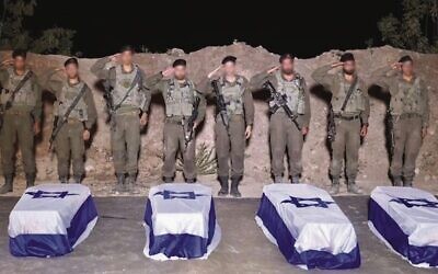 IDF troops salute over the caskets containing the bodies of slain hostages Guy Illouz, Bipin Joshi, Yossi Sharabi and Cpt. Daniel Perez. Photo: IDF