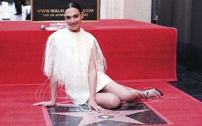 Gal Gadot poses with her star on the Hollywood Walk of Fame. 
Photo: Jordan Strauss/Invision/AP