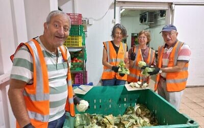 Sorting and preparing vegetables at Mizilot Mazon.