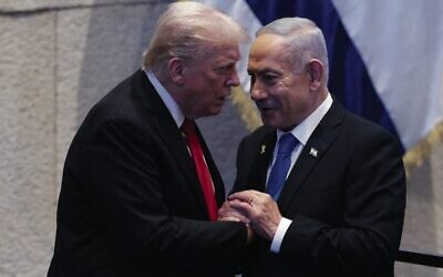 Donald Trump (left) speaks with Benjamin Netanyahu in the Knesset in October. Photo: Chip Somodevilla/Pool via AP