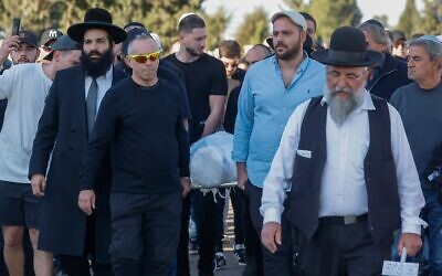 Friends and family attend the funeral of Dan Elkayam in Ashdod, December 25, 2025. Photo: Tal Gal/Flash90