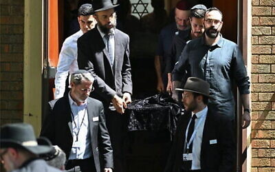 Pallbearers after the funeral service for Boris and Sofia Gurman, at the Sydney Chevra Kadisha on December 19. Photo: Saeed Khan/AFP