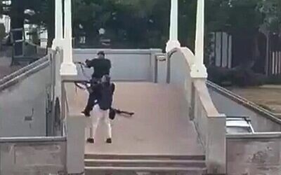 Sajid Akram, foreground, and Naveed Akram open fire in a terror attack on Chanukah event in Sydney on December 14, 2025. Photo: Times of Israel