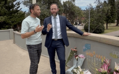 Rabbi Daniel Rabin (right) with Rabbi Yossi Friedman on the bridge at Bondi Beach. Rabbi Daniel Rabin (right) with Rabbi Yossi Friedman on the bridge at Bondi Beach.