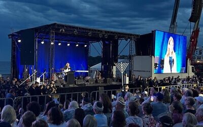 Kellie Sloane addressing the Light Over Darkness vigil at Bondi Beach on Sunday December 21. Photo: Facebook
