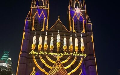 A menorah image projected onto St Mary's Cathedral in Sydney on December 17.