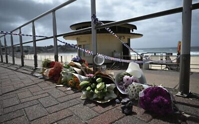 Flowers at Bondi Beach a day after the terrorist attack. 
Photo: AAP Image/Dean Lewins