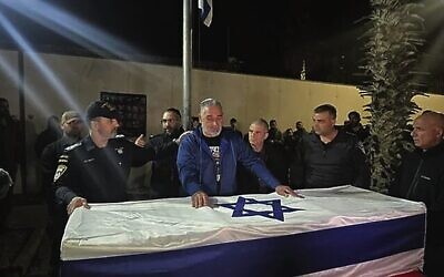 Police chief Daniel Levy (left) and Itzik Gvili (center) at an Israel Police ceremony for Gvili's slain hostage son, police Master Sgt. Ran Gvili, at the IDF's Nahal Base, on January 26, 2026. Photo: Times of Israel.