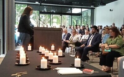 15 candles were lit at the memorial service at the University of Sydney on the National Day of Mourning. Photos: Shane Desiatnik