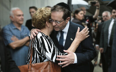 President Isaac Herzog embraces Eva Weitzen at Bondi Pavilion on Monday morning. Her husband Tibor was killed during the December 14 terrorist attack. Photo: Social media