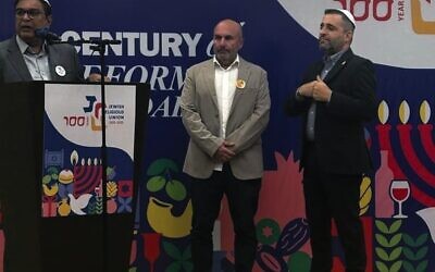 From left: Host Elijah Jacob, Danny Hochberg and Israel Consul-General Yaniv Revach.