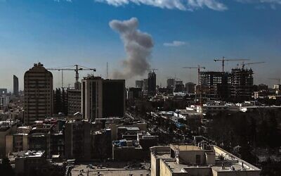 A plume of smoke rises following a reported explosion in Tehran on 
February 28. Photo: AFP