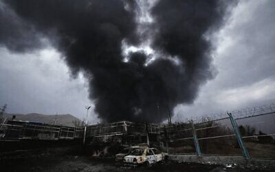 A thick plume of smoke rises from an oil storage facility in Tehran hit by an Israeli strike. Photo: AP Photo/Vahid Salemi