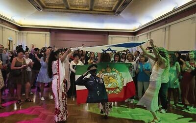 Sharon Kuper (right) dancing with Maral Mansouri from the Iranian community at Sunday's Jewish/Iranian event.