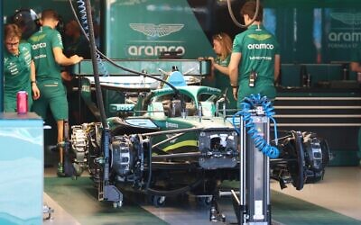 Engineers work on Lance Stroll's car in the Aston Martin garage. Photo: Peter Haskin Photography