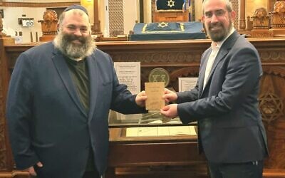 Ahron Adelist with Rabbi Glasman in front of the VAJEX Book of Remembrance. Photos: Rabbi Yaakov Glasman.