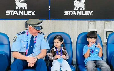 Detective Sergeant William Green with Daisy and Thommy Foghel at the Sydney FC match.