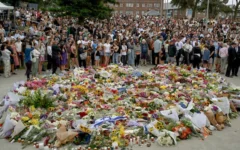 Mourners gather by floral tributes at the Bondi Pavilion in memory of the victims of a terror attack targeting the Jewish community at Bondi Beach in Sydney on December 15, 2025. (Saeed KHAN / AFP)