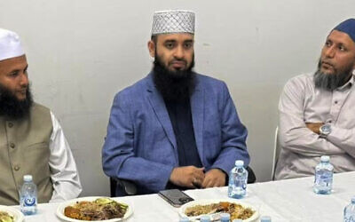 Controversial preacher Mizanur Rahman Azhari (centre) was in Brisbane on Sunday, before he was deported. Picture: Facebook