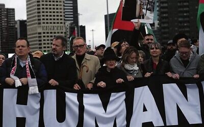 Sydney mayor Clover Moore stands next to former foreign minister Bob Carr under a poster of the Ayatollah at the march over the Sydney Harbour Bridge. Photo: X.