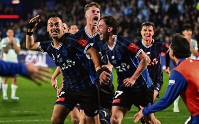 Jake Girdwood-Reich (second from left) celebrates with teammates after Cam Howieson (left) scored for Auckland FC in their 1-0 A-League Men's grand final win over Sydney FC at Go Media Stadium on May 23. 
Photo: AAP Image/
Photosport/Andrew Cornaga