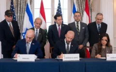 US Secretary of State Marco Rubio and others watch, as seated from left, Israel's Ambassador to the US Yechiel Leiter, counselor Dan Holler, and Lebanon's Ambassador to the US Nada Hamadeh, sign a framework agreement, described as a first step toward peace following months of conflict between Israel and Iran-backed Hezbollah, at the State Department, June 26, 2026, in Washington. (AP Photo/Kevin Wolf)
